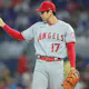 Shohei Ohtani of the Los Angeles Angels reacts after a pitch and we offer our top odds and player props for Ohtani on Opening Day vs. the Athletics.