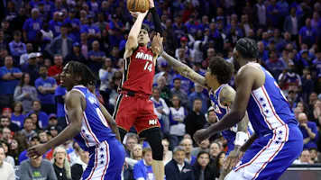 Tyler Herro of the Miami Heat shoots over Kelly Oubre Jr. of the Philadelphia 76ers during the fourth quarter of the Eastern Conference Play-In Tournament. We're backing Herro in our Bulls vs. Heat player props & odds.