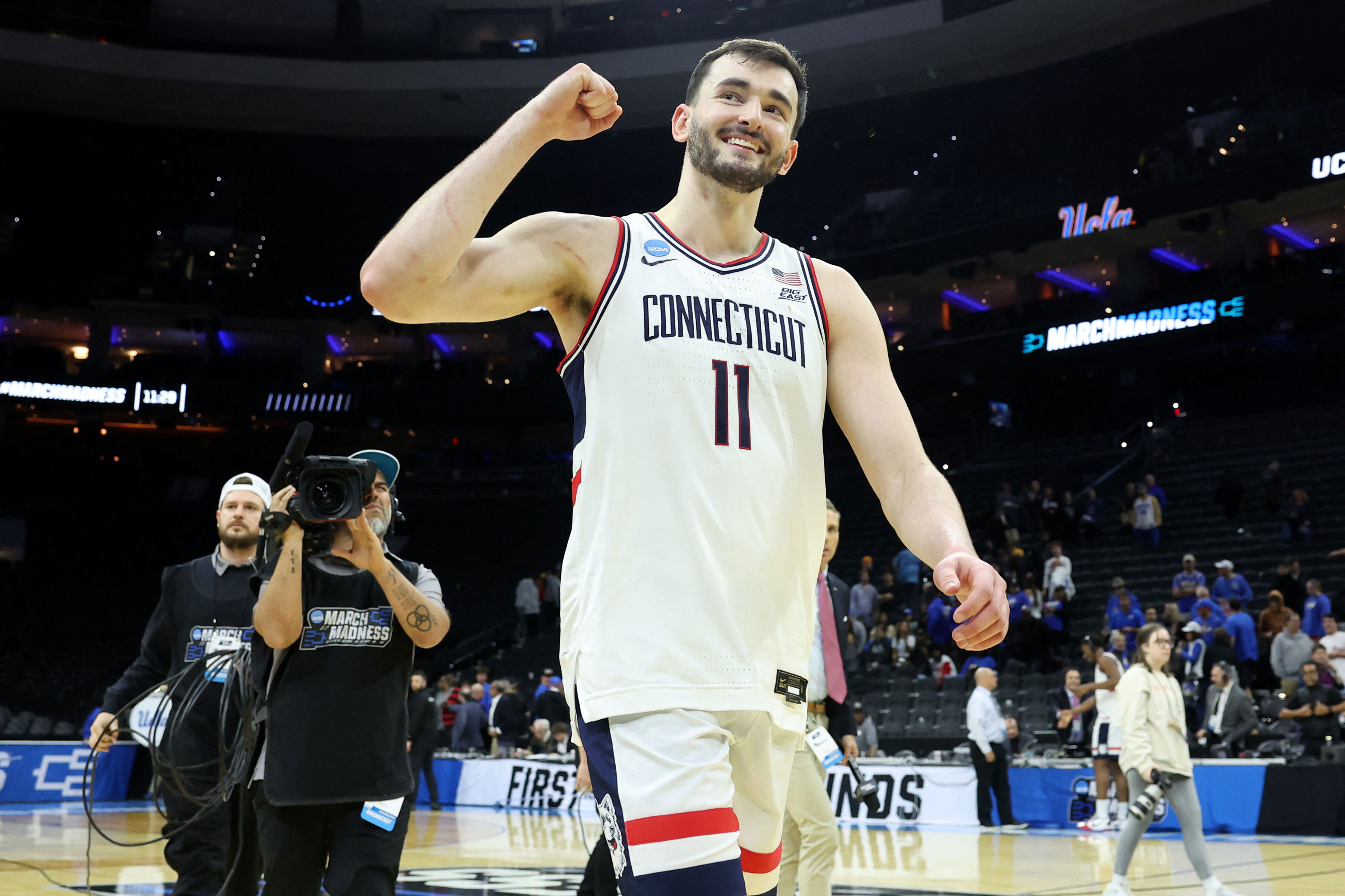 UConn Huskies forward Alex Karaban celebrates, and he's key as we look at our UConn vs. Duke prediction.