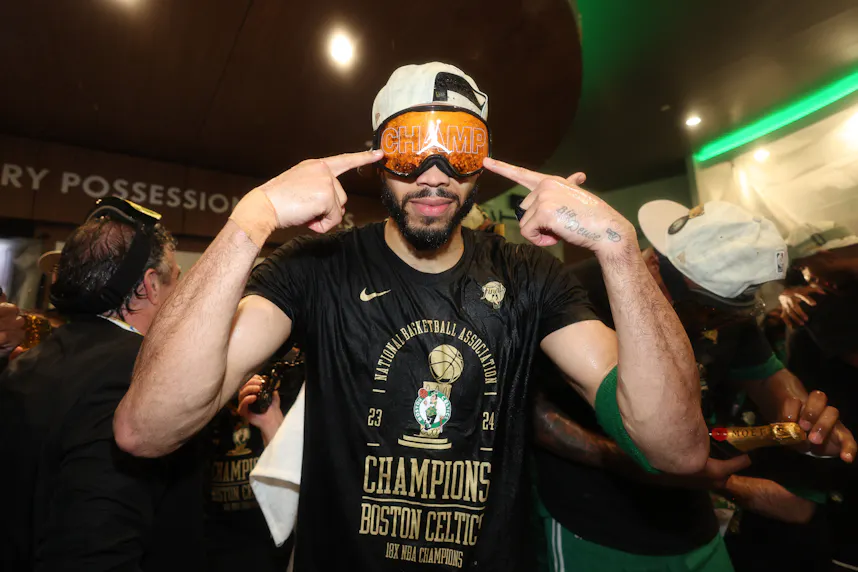 Boston Celtics forward Jayson Tatum celebrates in the locker room as we look at Massachusetts' sports betting financials for May 2024.