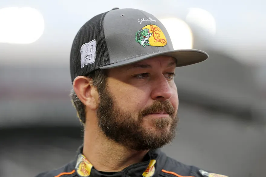 Martin Truex Jr. waits on the grid prior to the NASCAR Cup Series Bass Pro Shops Night Race, and he headlines our top odds and picks for Sunday's FireKeepers Casino 400.