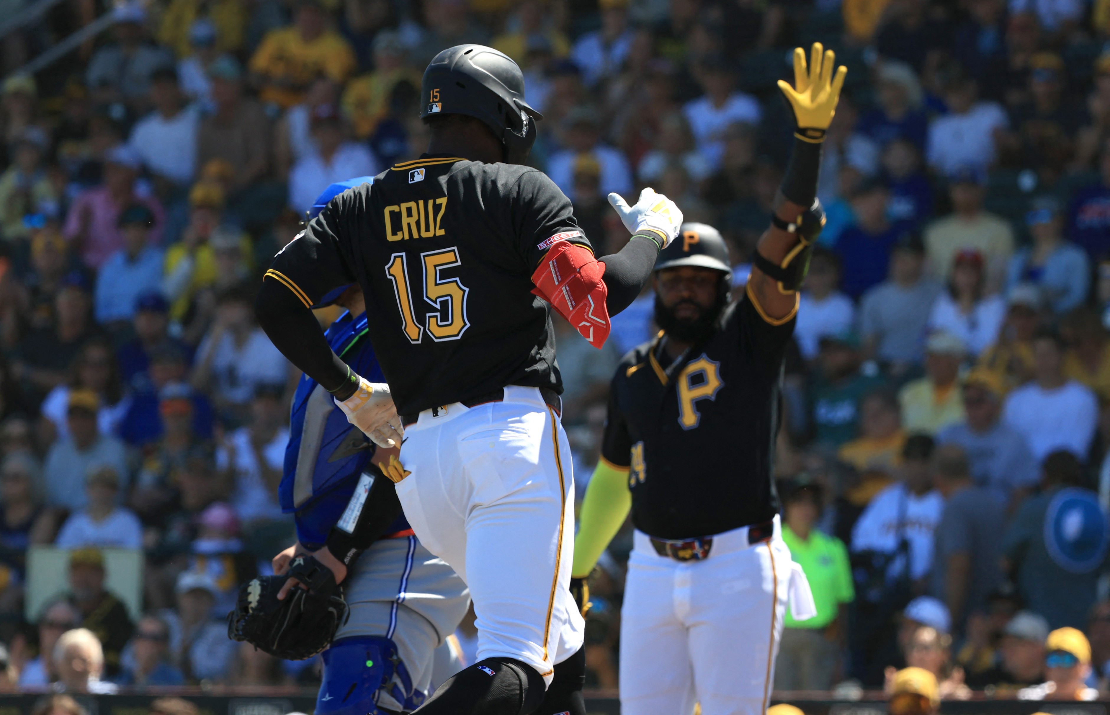 Pittsburgh Pirates center fielder Oneil Cruz (15) scores a run as he is featured in our Pirates vs. Mets prediction & picks.
