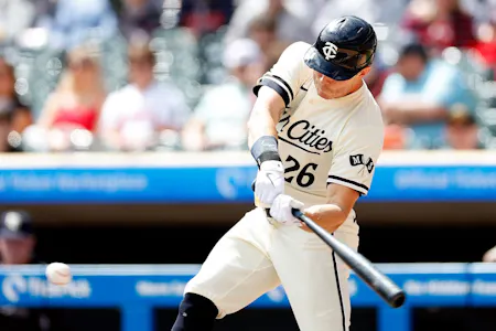 Max Kepler (26) of the Minnesota Twins hits an RBI single, as we offer our best MLB player props and expert picks for Saturday.