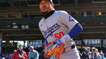Mookie Betts of the Los Angeles Dodgers takes the field before the game against the Chicago Cubs, and we offer a look at the top MLB MVP odds based on the best MLB odds.