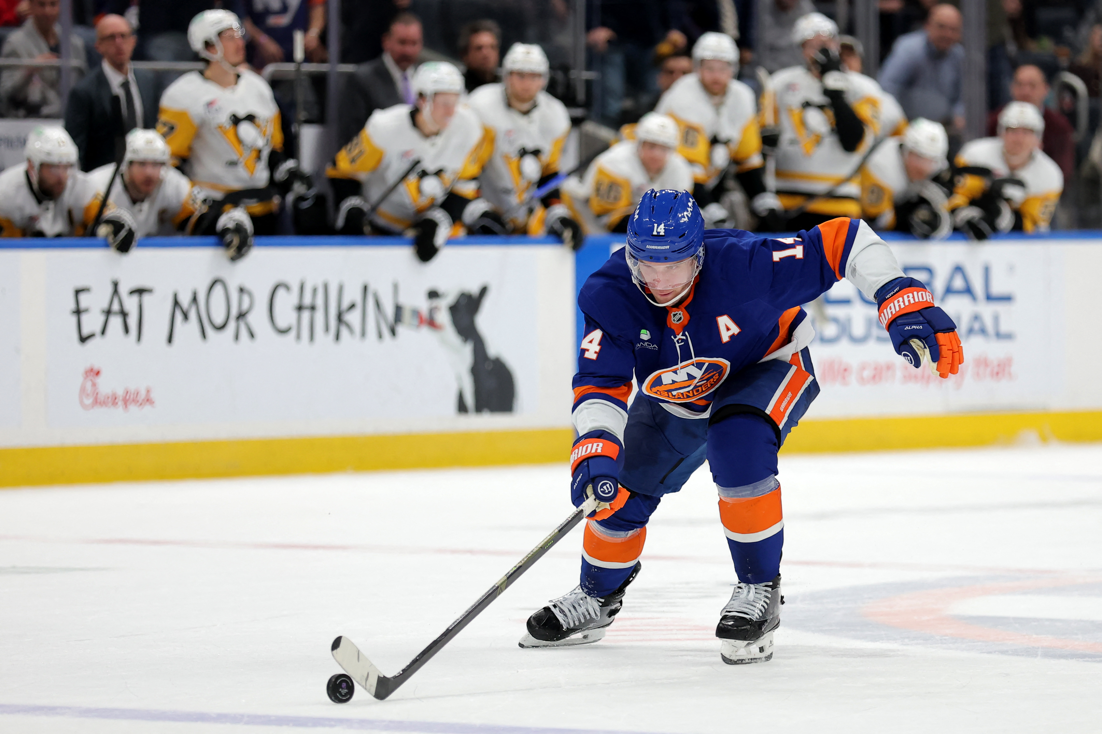 New York Islanders center Bo Horvat brings the puck up ice as we make our best Penguins vs. Islands prediction & parlay