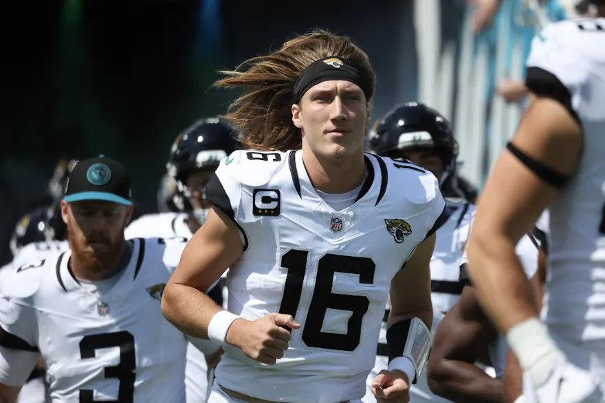 Trevor Lawrence of the Jacksonville Jaguars runs onto the field before the game against the Houston Texans as we look at our Falcons-Jaguars prediction.