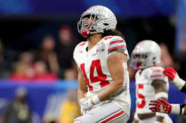  J.T. Tuimoloau of the Ohio State Buckeyes celebrates after a sack during the third quarter against the Georgia Bulldogs in the Chick-fil-A Peach Bowl. Ohio State is among the favorites by the 2025 college football championship odds. 