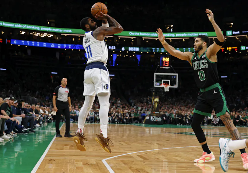 Dallas Mavericks guard Kyrie Irving shoots the ball against Boston Celtics forward Jayson Tatum during the first quarter of Game 2 of the 2024 NBA Finals at TD Garden. We're fading Irving in our Celtics vs. Mavericks Player Props.