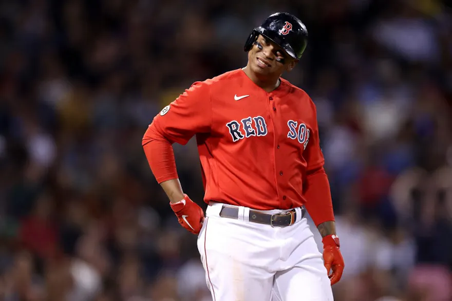 Rafael Devers of the Boston Red Sox looks on during the eighth inning against the Kansas City Royals and we offer our look at the top futures odds and picks for the Red Sox in 2023.