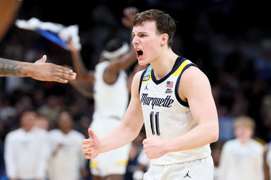 Tyler Kolek #11 of the Marquette Golden Eagles celebrates as we make our March Madness survivor picks ahead of the Sweet 16 round of the NCAA Tournament.