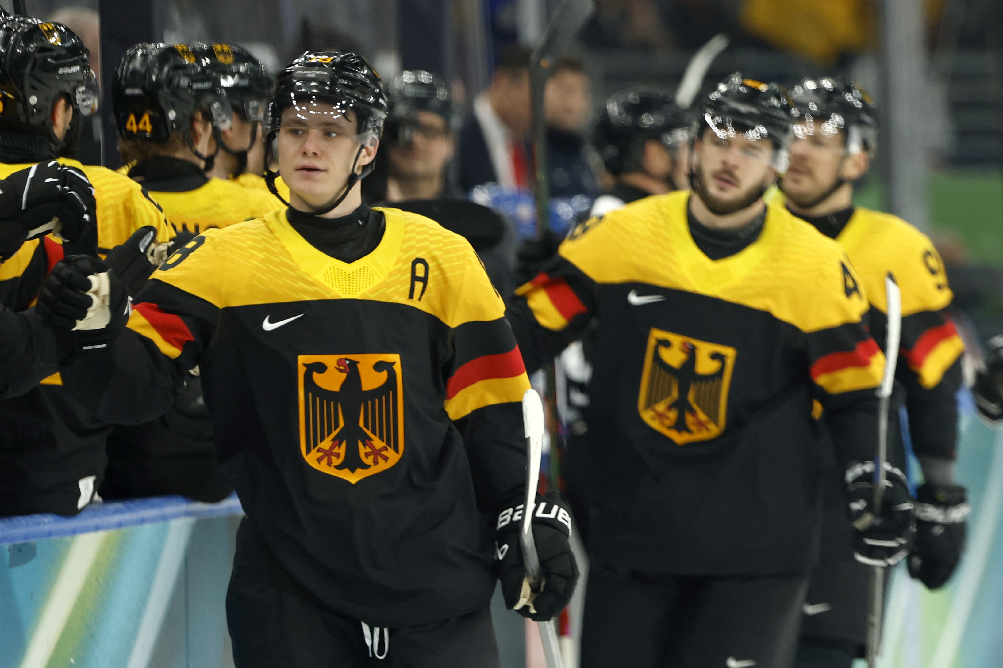 Tim Stutzle celebrating with teammates as we provide our Germany vs. France prediction and  expert picks today.
