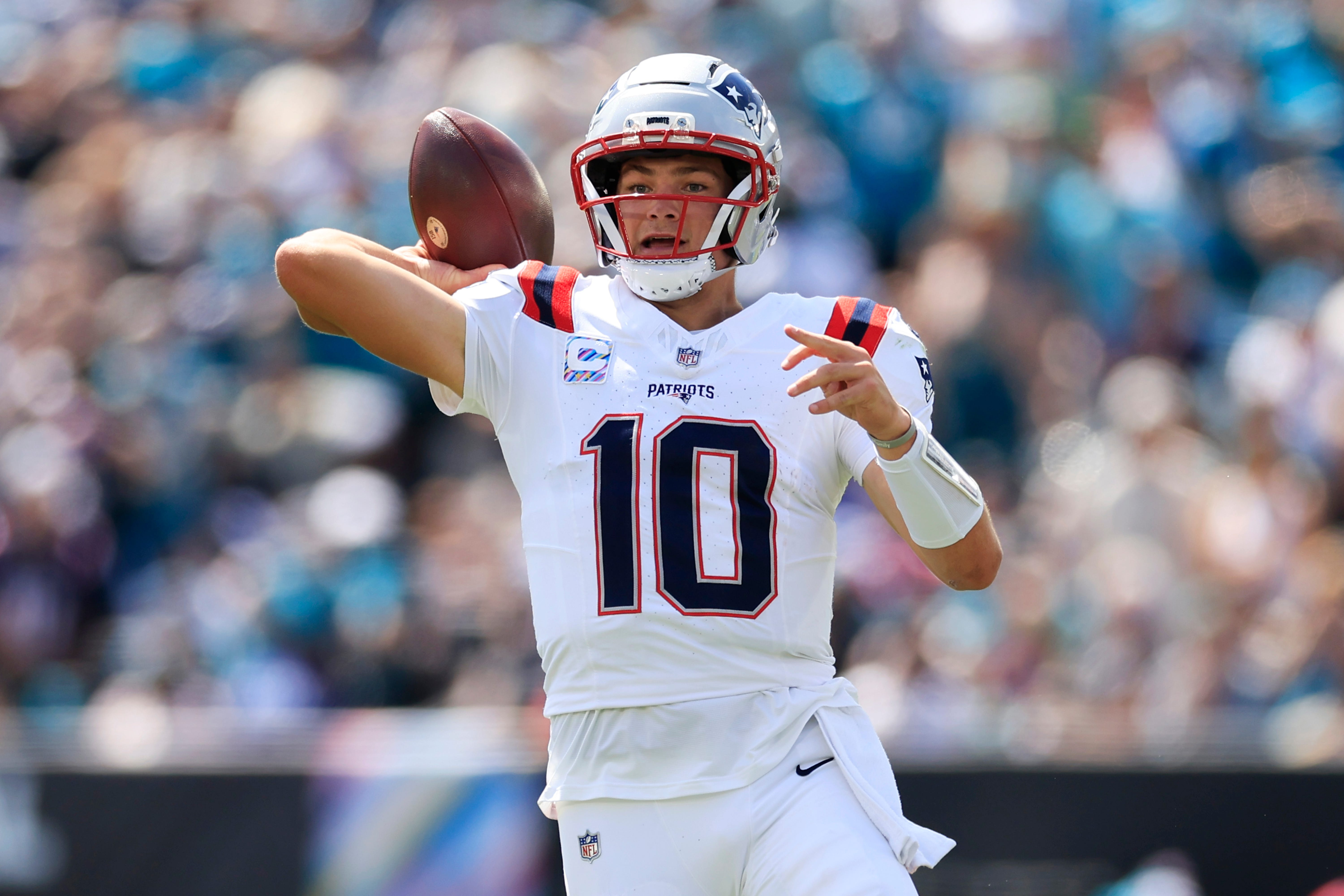Patriots quarterback Drake Maye (10) looks to pass as we break down our Patriots vs. Bills prediction.