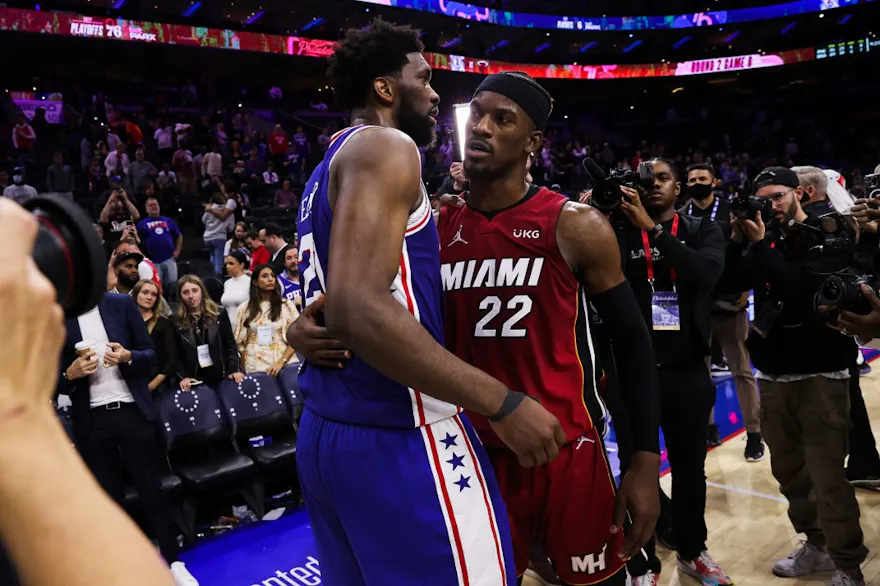 Joel Embiid of the Philadelphia 76ers and Jimmy Butler of the Miami Heat hug as we look at the top NBA MVP odds