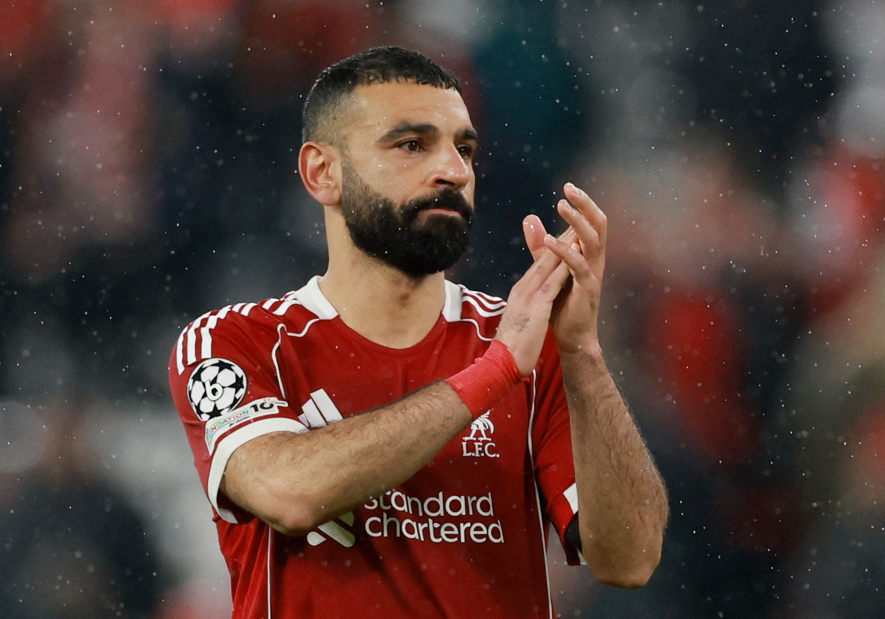 Liverpool's Mohamed Salah looks dejected as he applauds fans after the match as he is featured in our Everton vs. Liverpool prediction, picks & odds.