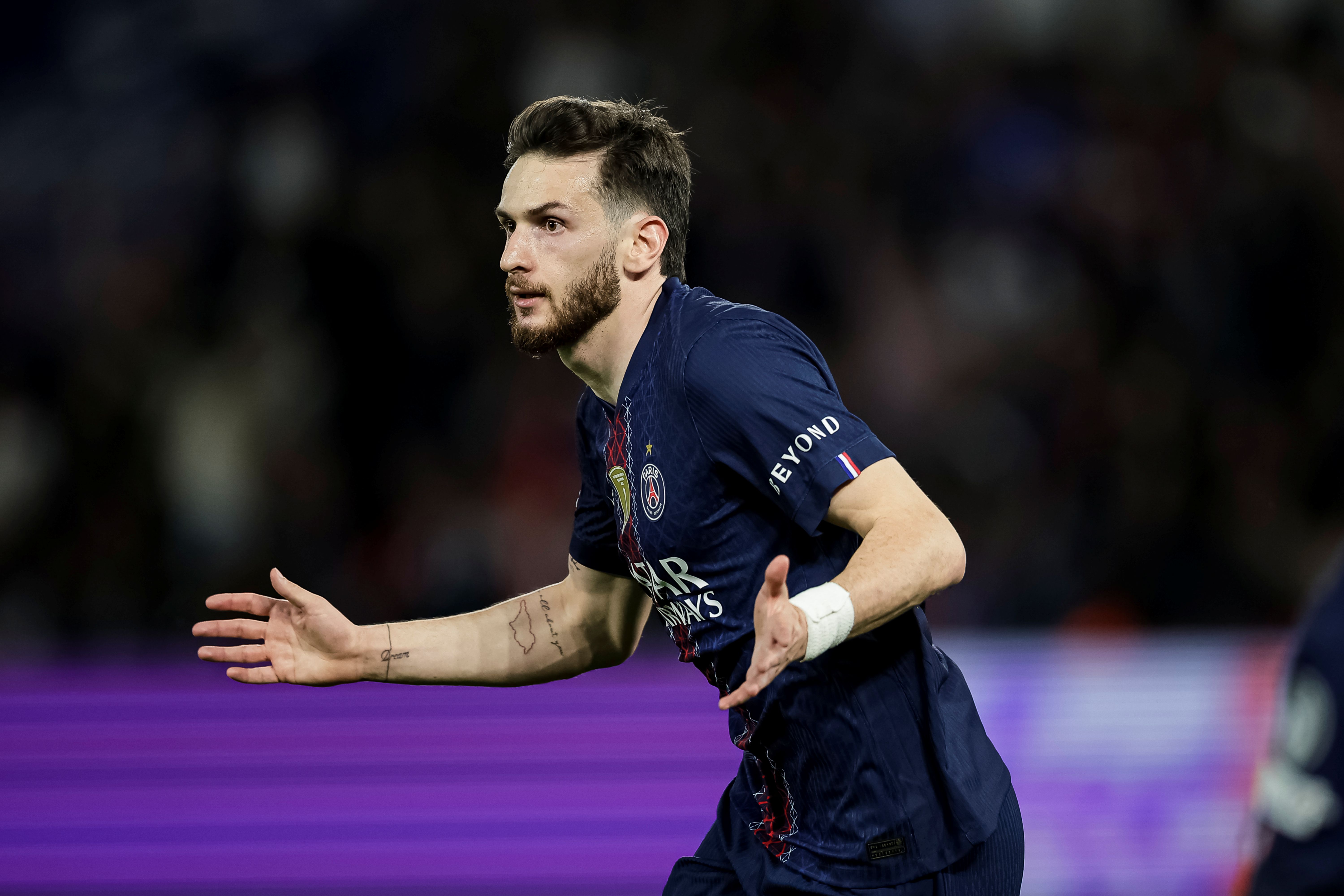 Khvicha Kvaratskhelia of Paris Saint-Germain celebrates as we make our best Liverpool vs. PSG prediction.