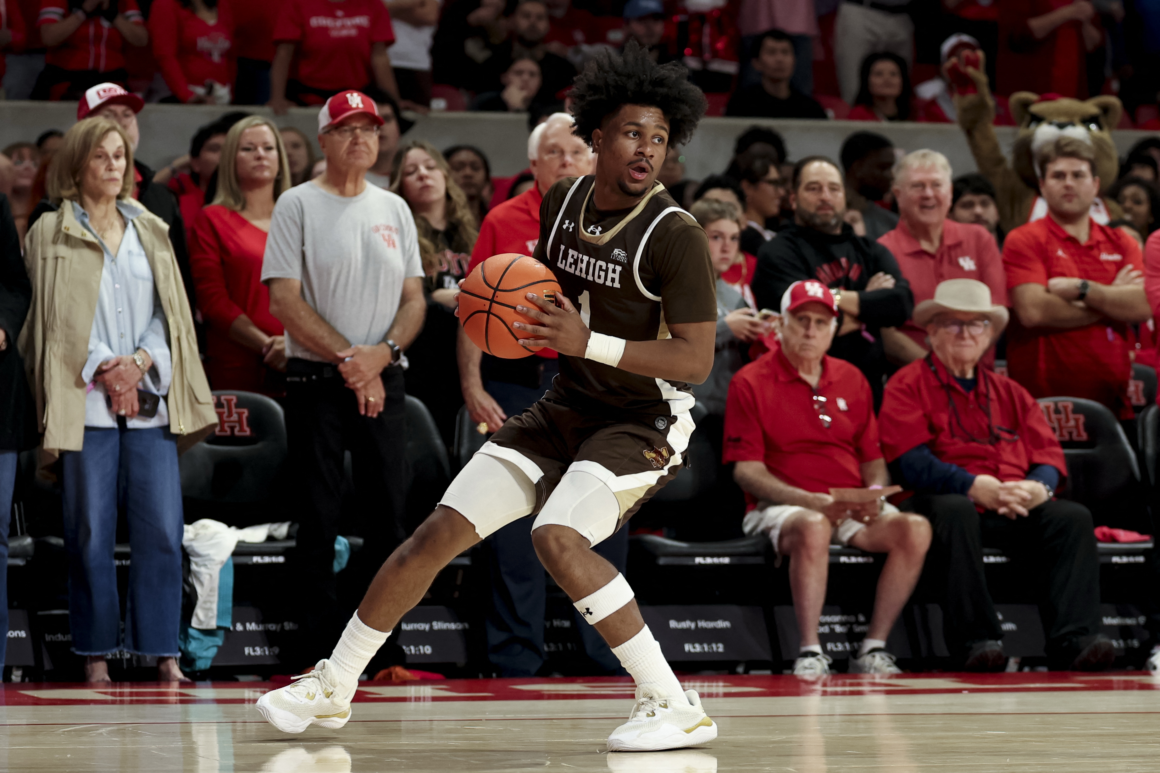 Lehigh Mountain Hawks guard Nasir Whitlock controls the ball as we offer our best Prairie View A&M vs. Lehigh prediction