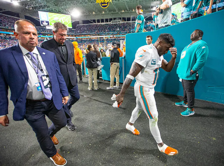 Miami Dolphins wide receiver Tyreek Hill walks off the field dejected as we make our best Tyreek Hill MNF player prop bets.