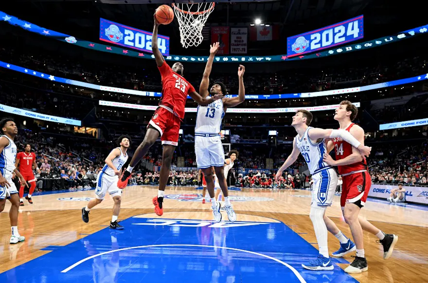 Mohamed Diarra #23 of the North Carolina State Wolfpack dunks the ball as we look at our DraftKings North Carolina promo code