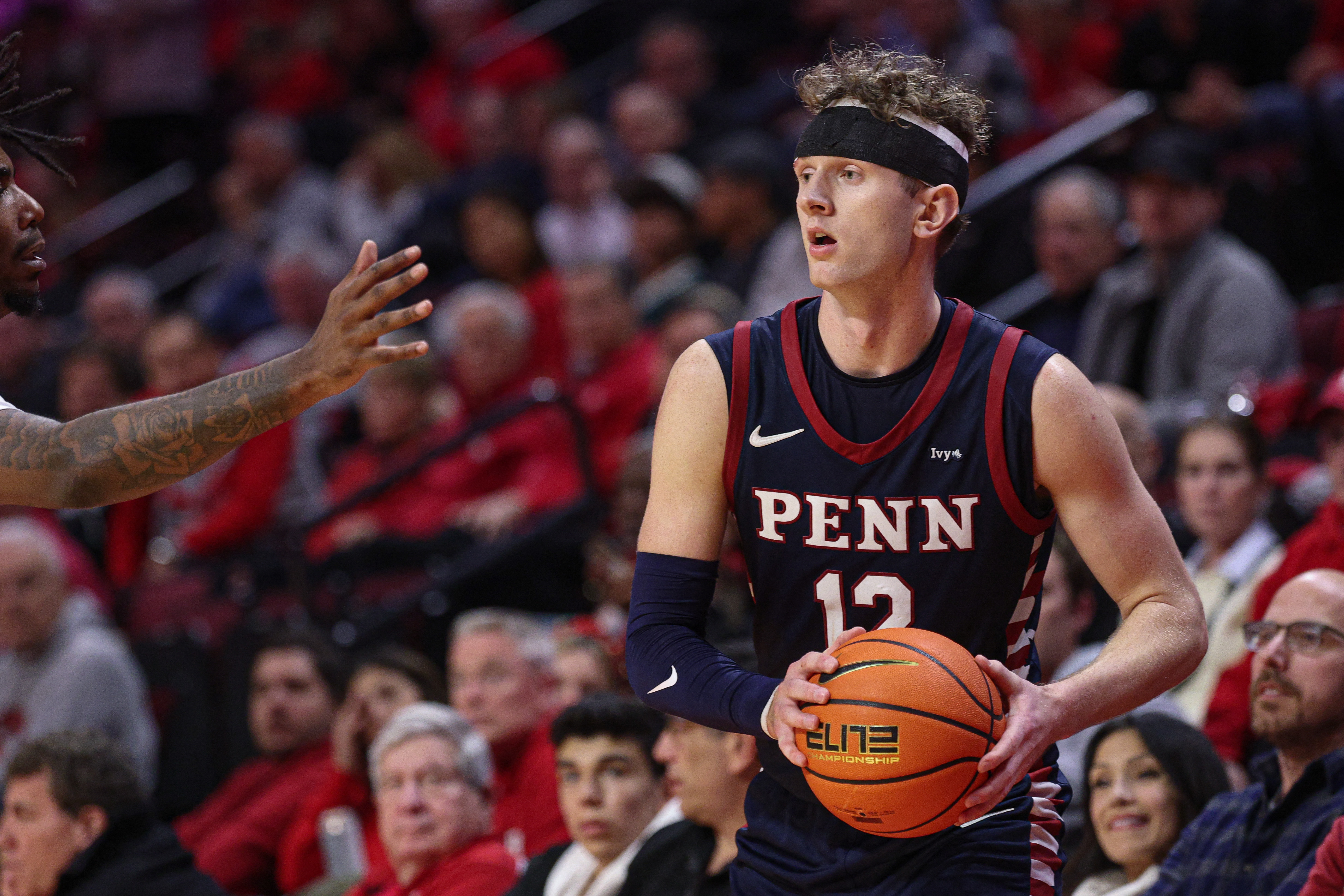 Penn Quakers forward TJ Power looks to pass as we make our best Pennsylvania vs. Yale prediction.