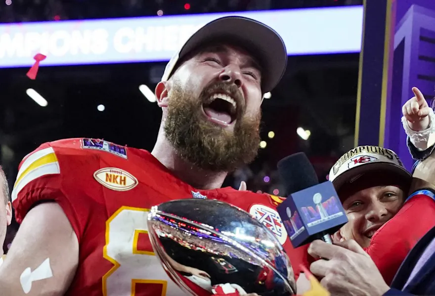 Travis Kelce holds the Lombardi Trophy as we look at our printable Super Bowl prop bet sheet.