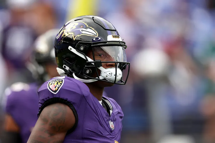 Wide receiver Zay Flowers of the Baltimore Ravens warms up before the start of a preseason game against the Philadelphia Eagles, and we preview the Ravens vs. Commanders game with our best odds and picks.