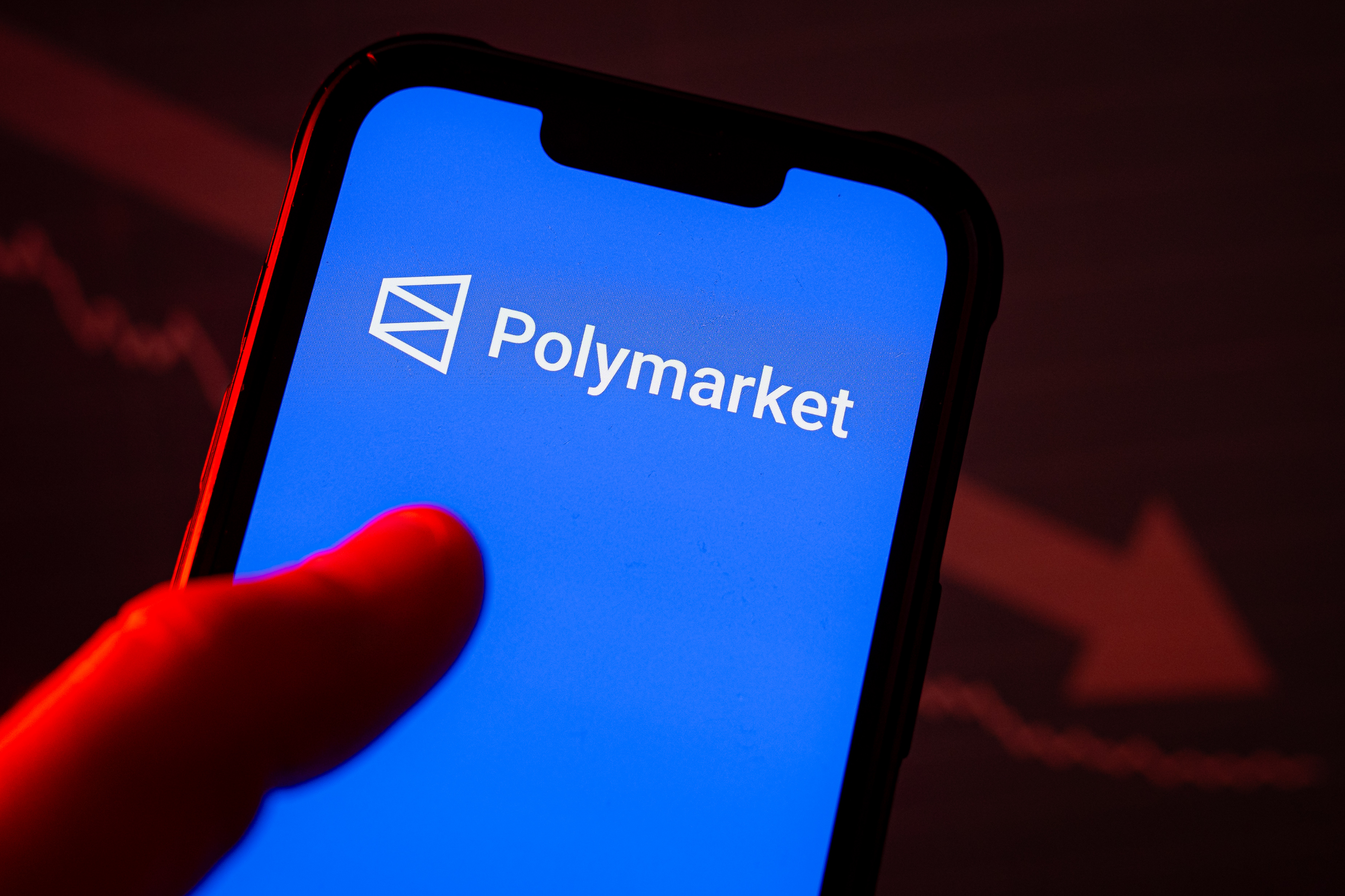 In this photo illustration, a Polymarket logo seen displayed on a smartphone as we look at the partnership between it and PrizePicks