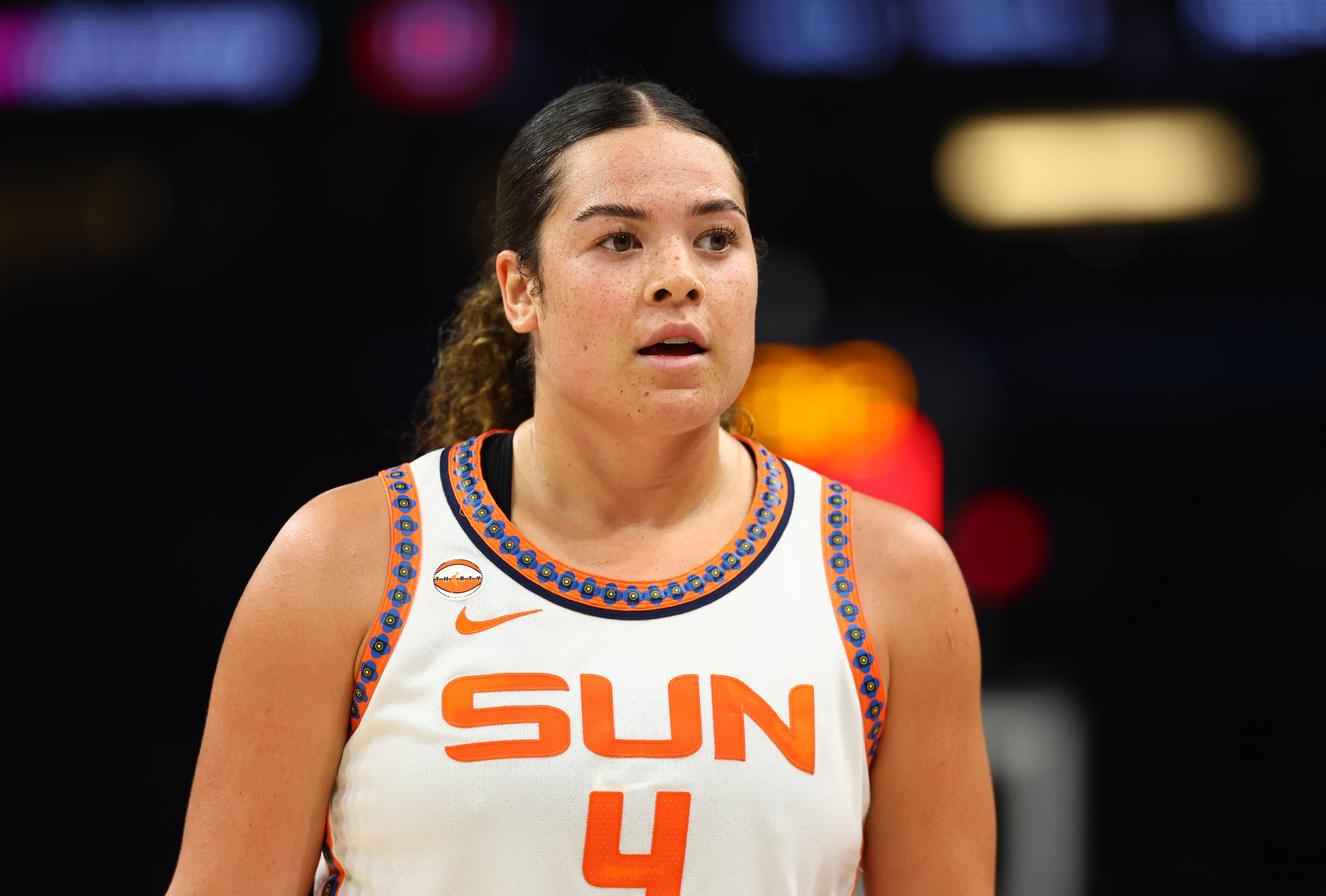 Connecticut Sun guard Charlisse Leger-Walker (4) looks on as we break down our Sun vs. Fever prediction.