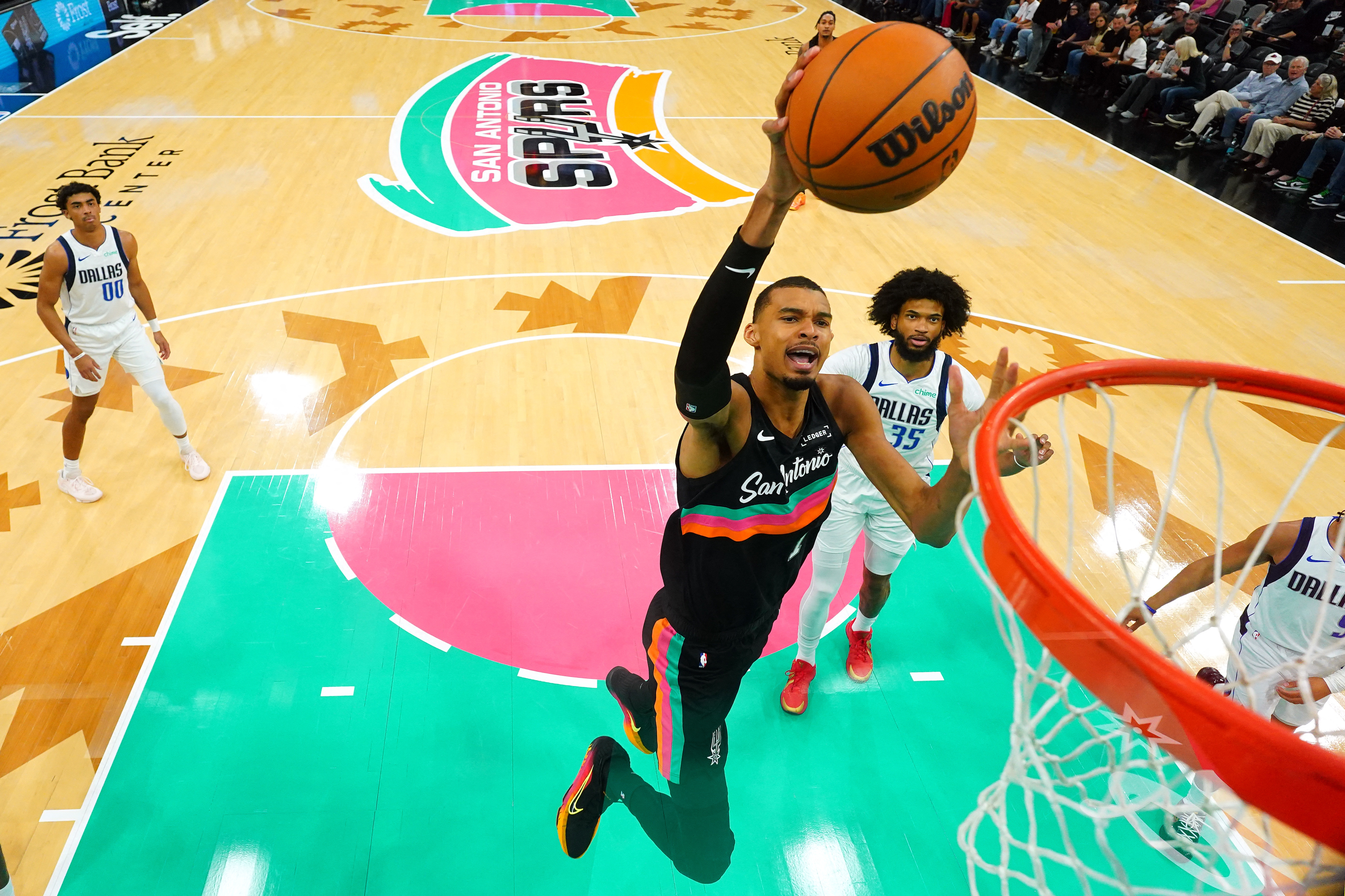 San Antonio Spurs forward Victor Wembanyama (1) goes up to dunk as we break down our Will Victor Wembanyama play in game 3 against the Portland Trail Blazers. 