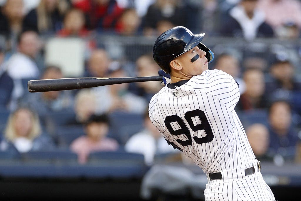 Aaron Judge #99 of the New York Yankees hits a home run against the Cleveland Guardians during the second inning in game five of the American League Division Series at Yankee Stadium on October 18, 2022 in New York, New York. Photo by Sarah Stier/Getty Images via AFP.