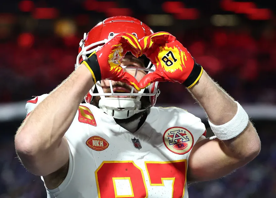 Travis Kelce #87 of the Kansas City Chiefs celebrates as we make our Travis Kelce NFL player props picks and predictions for Sunday's AFC Championship Game between the Chiefs vs. Ravens.