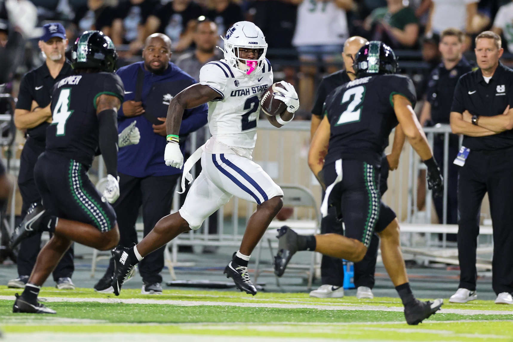 Utah State Aggies running back Miles Davis runs away from defenders, and he's key as we look at our Washington State vs. Utah State prediction.