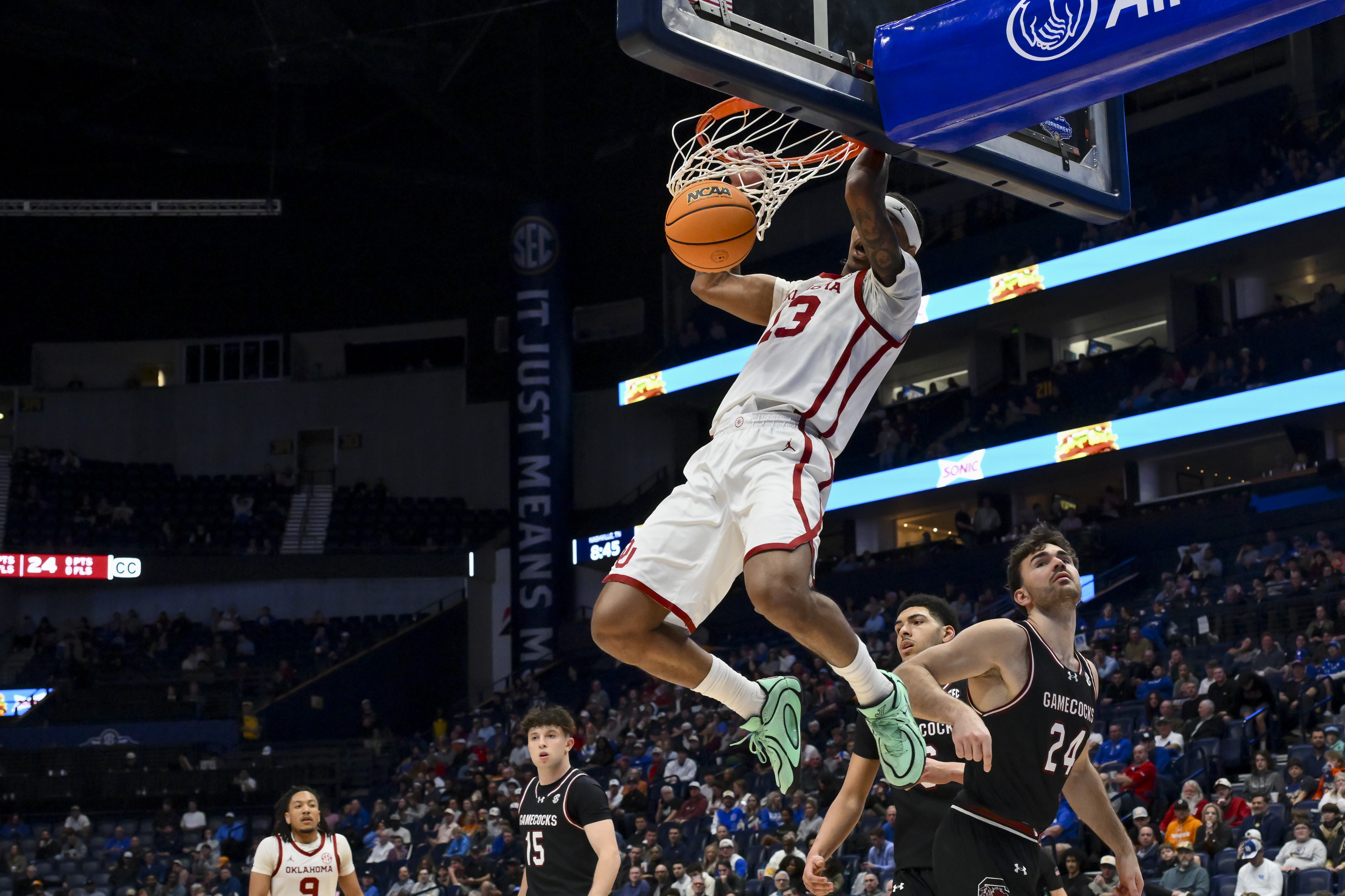 Oklahoma Sooners forward Tae Davis dunks the ball as we make our best Oklahoma vs. Colorado prediction.