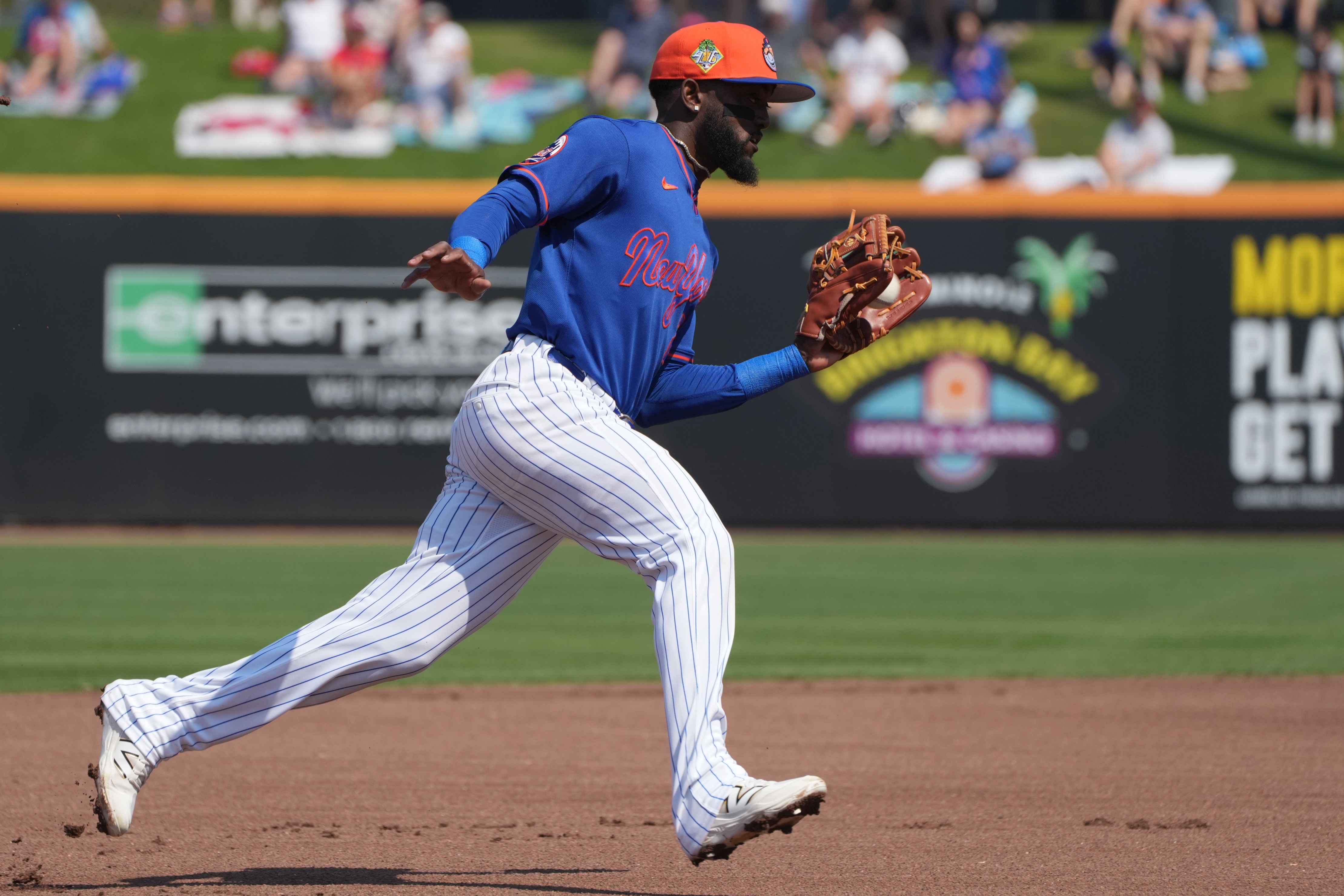 New York Mets third baseman Vidal Bruján fields a ground ball as we look at a New York bill to make sportsbooks release win-loss statements.
