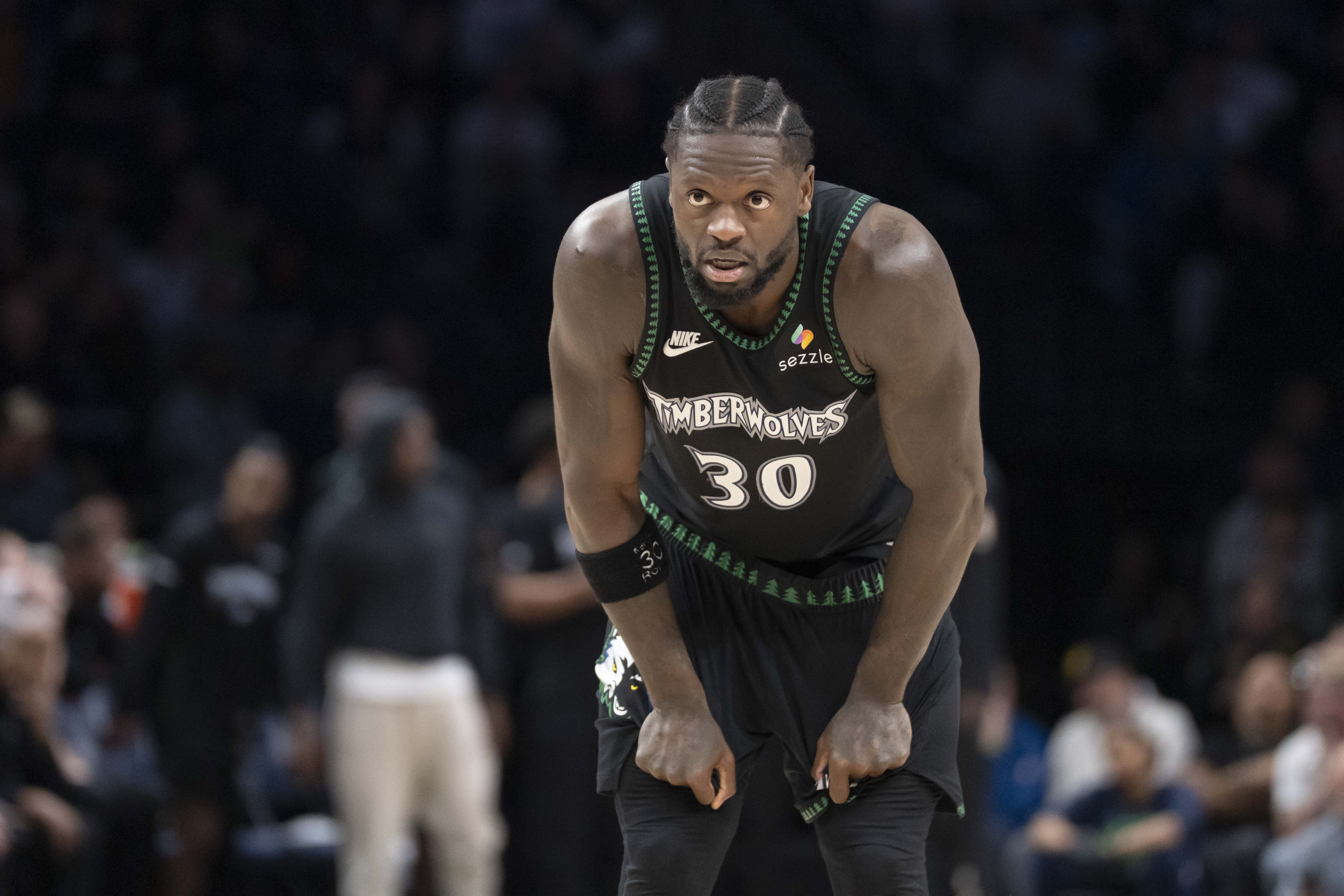 Minnesota Timberwolves forward Julius Randle (30), seen here looking on during a game, plays a key role in my Thunder vs. Timberwolves prediction.