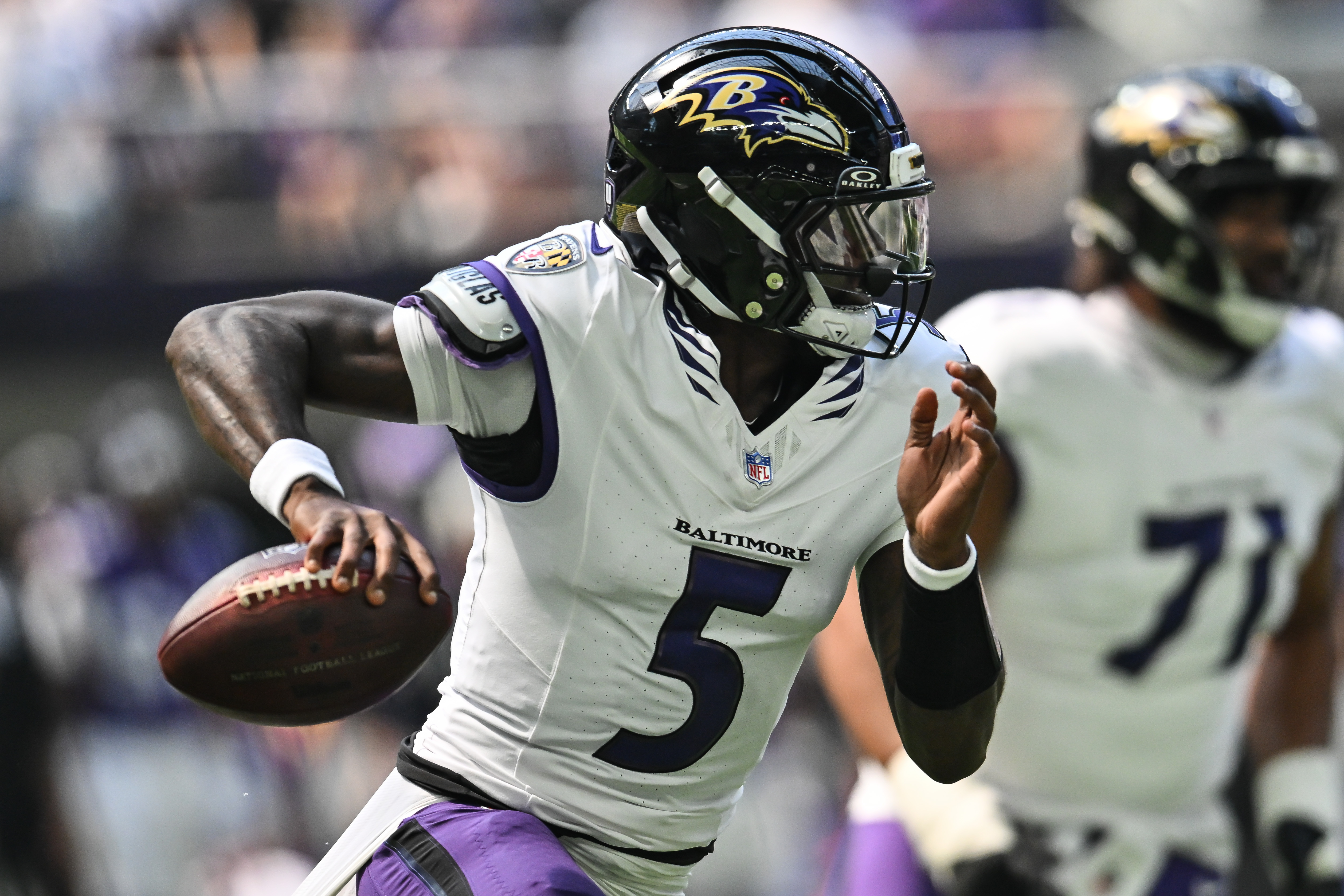 Baltimore Ravens quarterback Tyler Huntley (5) scrambles out of the pocket as we break down our Commanders vs. Ravens prediction.