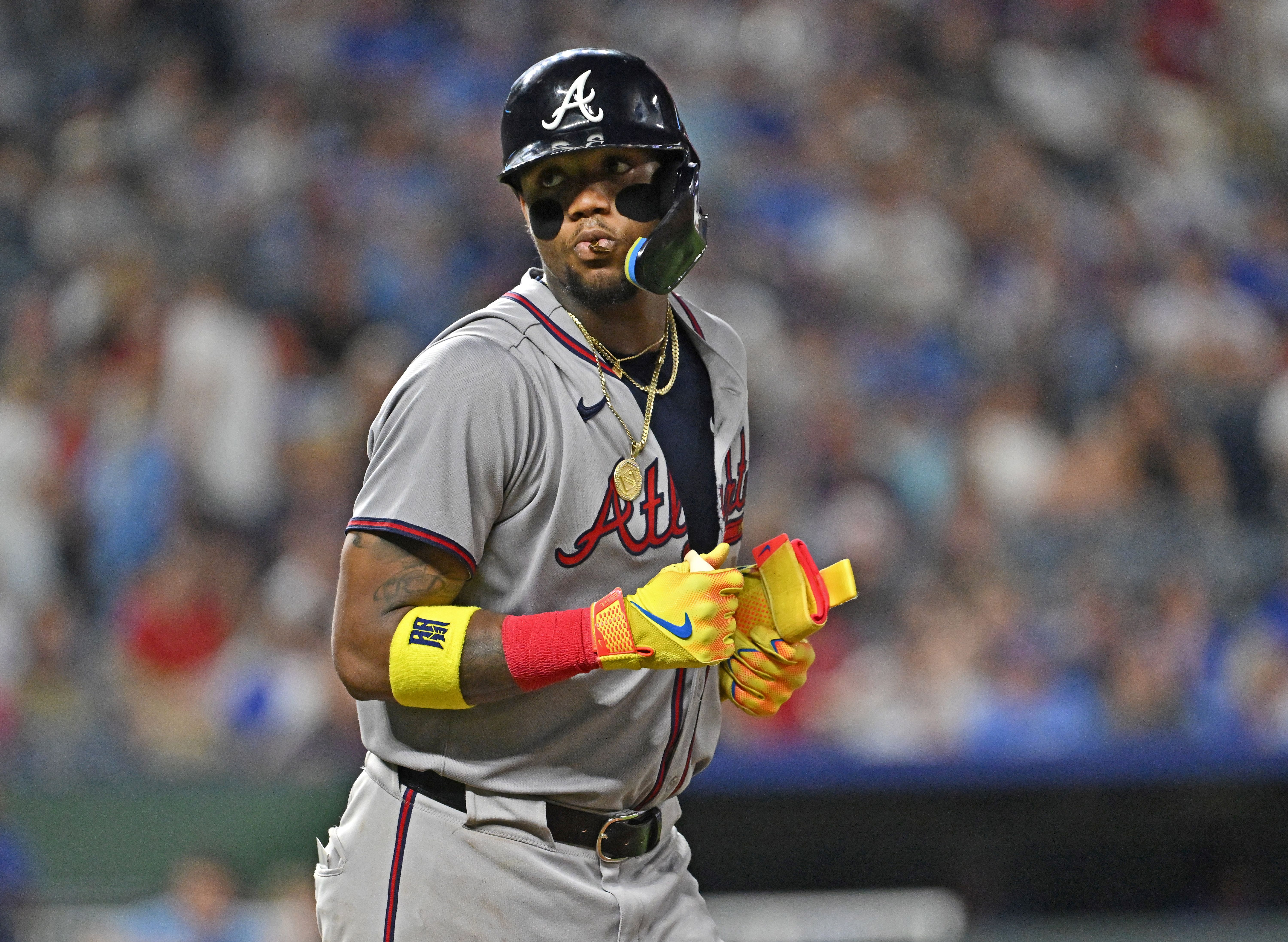 Atlanta Braves right fielder Ronald Acuna Jr. walks to first base, and he's key as we make our Netherlands vs. Venezuela predictions.