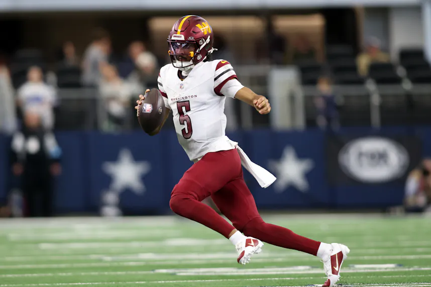 Washington Commanders quarterback Jayden Daniels runs the ball as we make our Wild Card Weekend player prop picks.