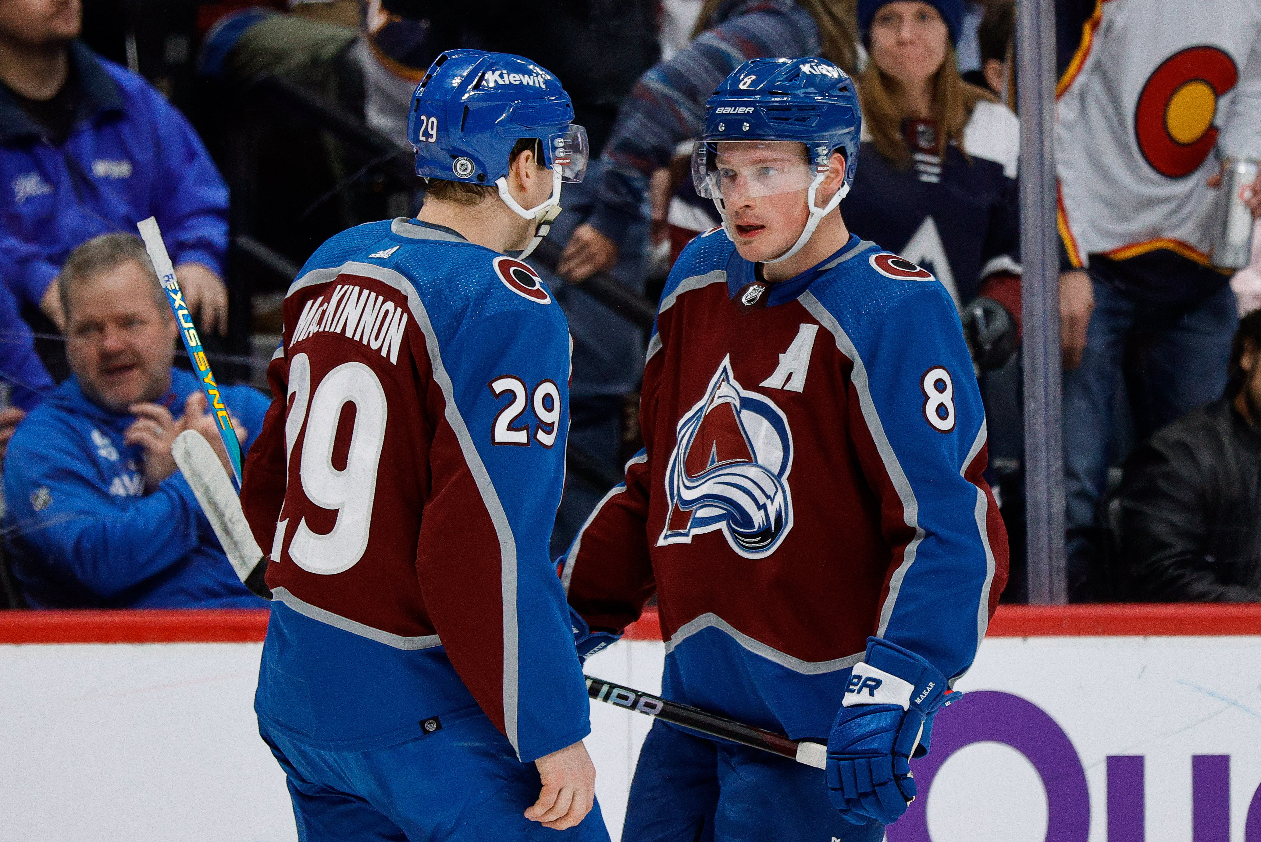 Colorado Avalanche center Nathan MacKinnon (29) talks with defenseman Cale Makar (8) as we break down the Stanley Cup odds