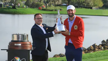 Scottie Scheffler of The United States is presented with the trophy as we look at the FedEx Cup odds