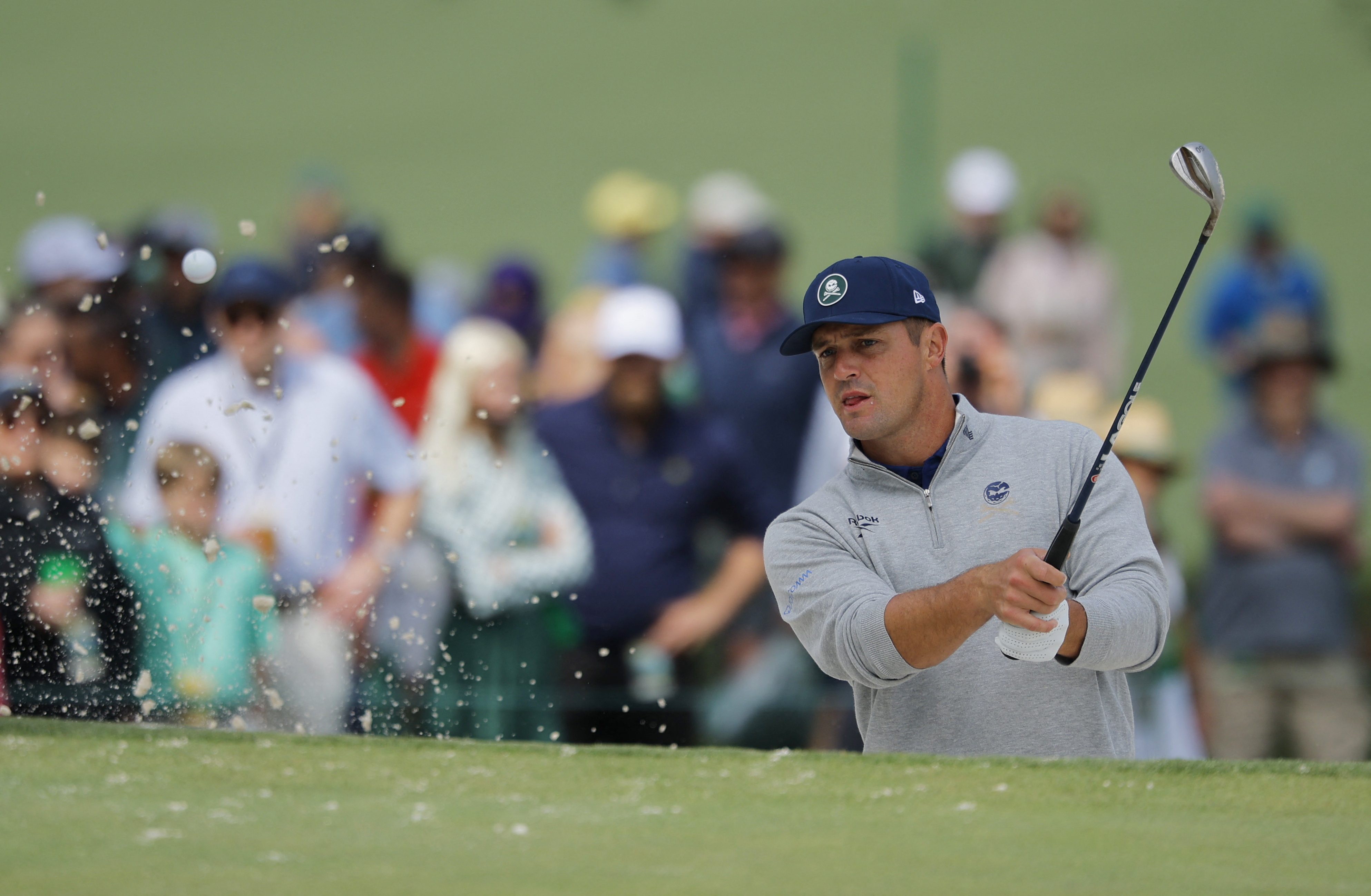 Bryson DeChambeau plays out from the bunker on the 7th hole during a practice round at Augusta National.