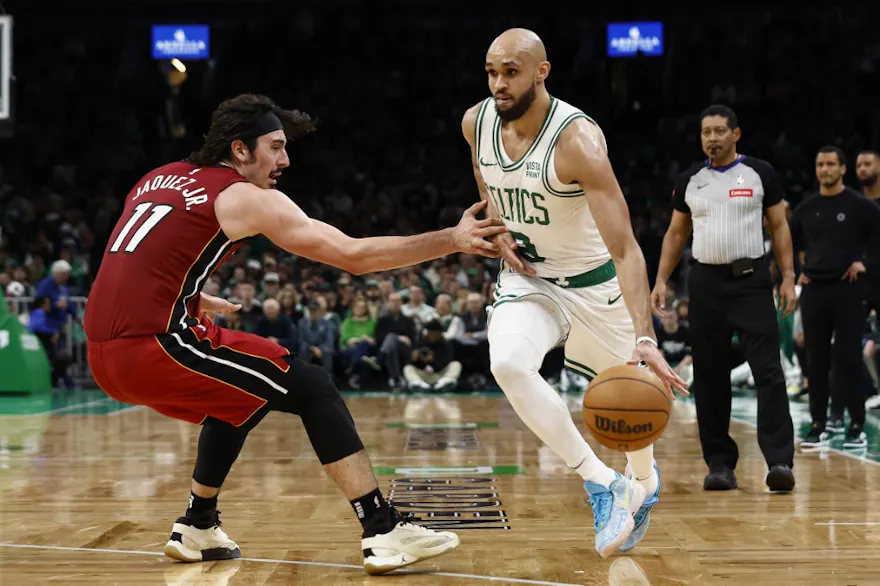 Jaime Jaquez Jr. of the Miami Heat tries to stop Derrick White of the Boston Celtics from going past him during Game 1. We're backing White in our Heat vs. Celtics player props. 