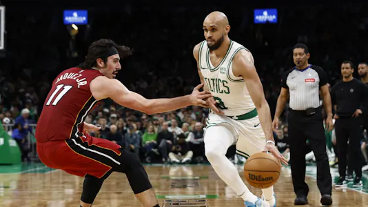 Jaime Jaquez Jr. of the Miami Heat tries to stop Derrick White of the Boston Celtics from going past him during Game 1. We're backing White in our Heat vs. Celtics player props. 