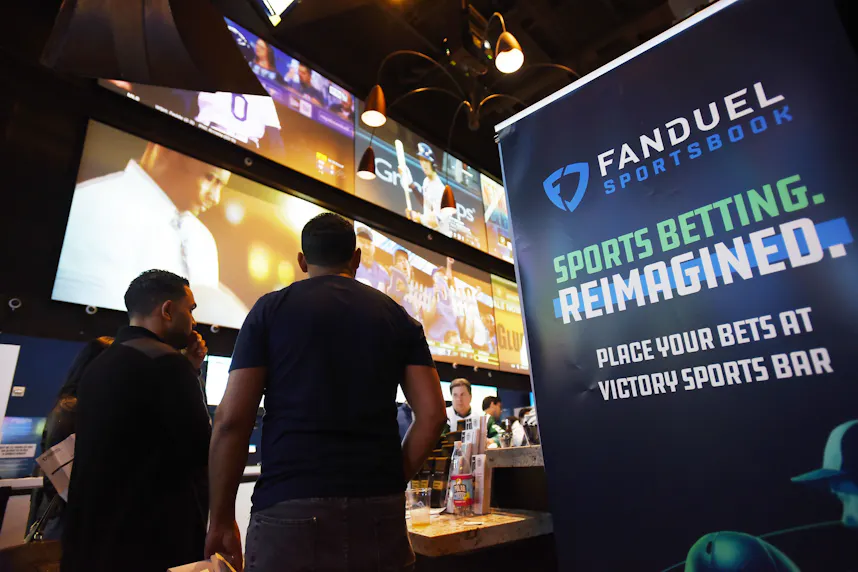 Fans watch TV screens during a game viewing party for fans at the FanDuel Sportsbook as we look at the operators Responsible Gaming Education Month initiative.