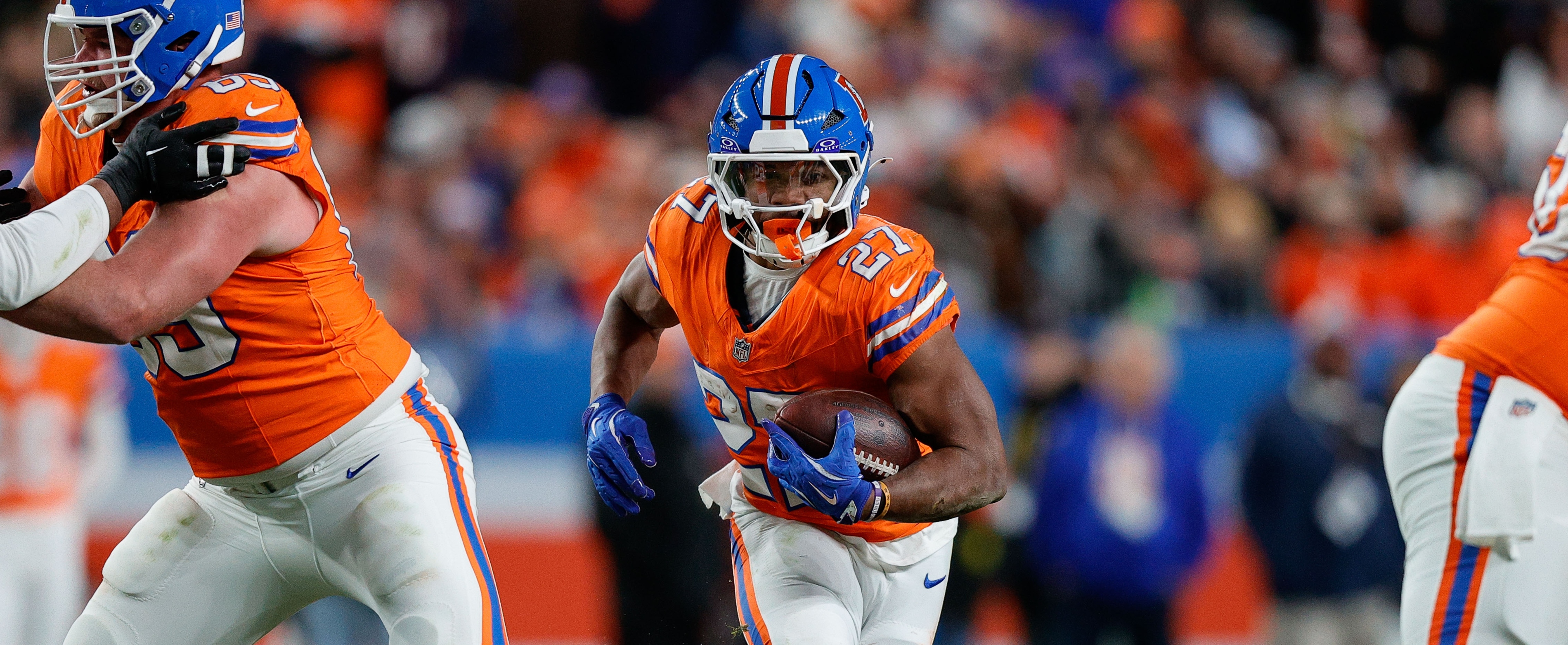 Denver Broncos running back J.K. Dobbins (27) runs the ball in the fourth quarter against the Las Vegas Raiders at Empower Field at Mile High