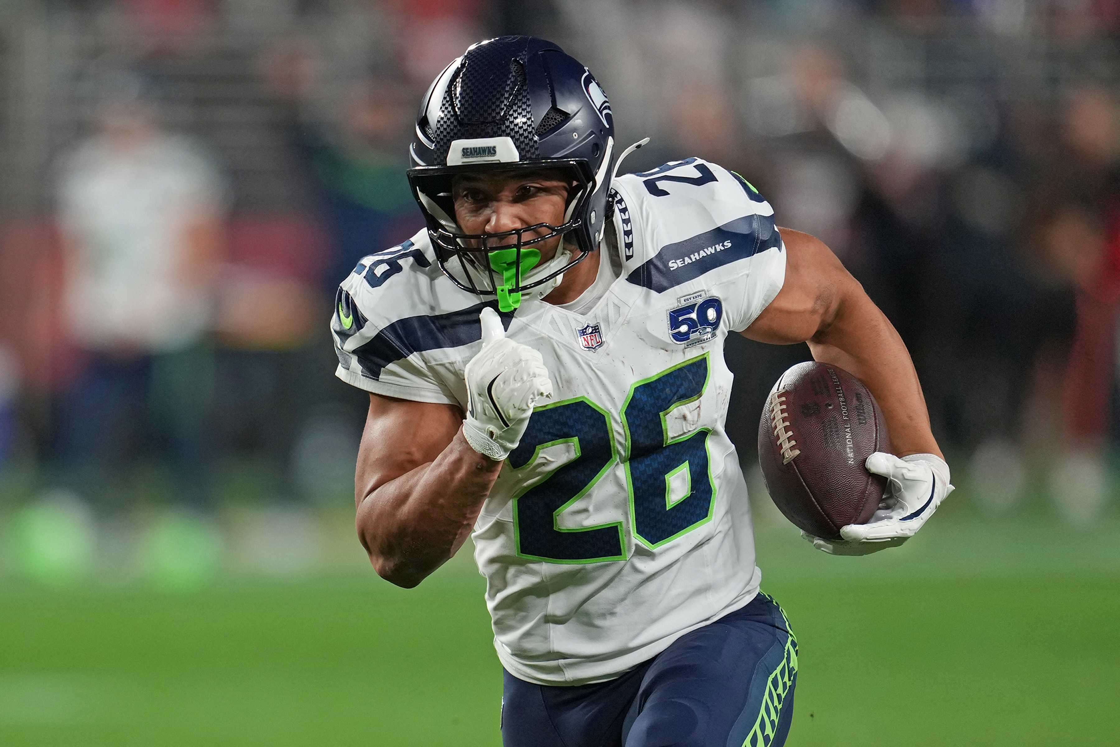 Seattle Seahawks running back Zach Charbonnet (26) rushes the ball as we break down our first touchdown scorer predictions for 49ers vs. Seahawks.