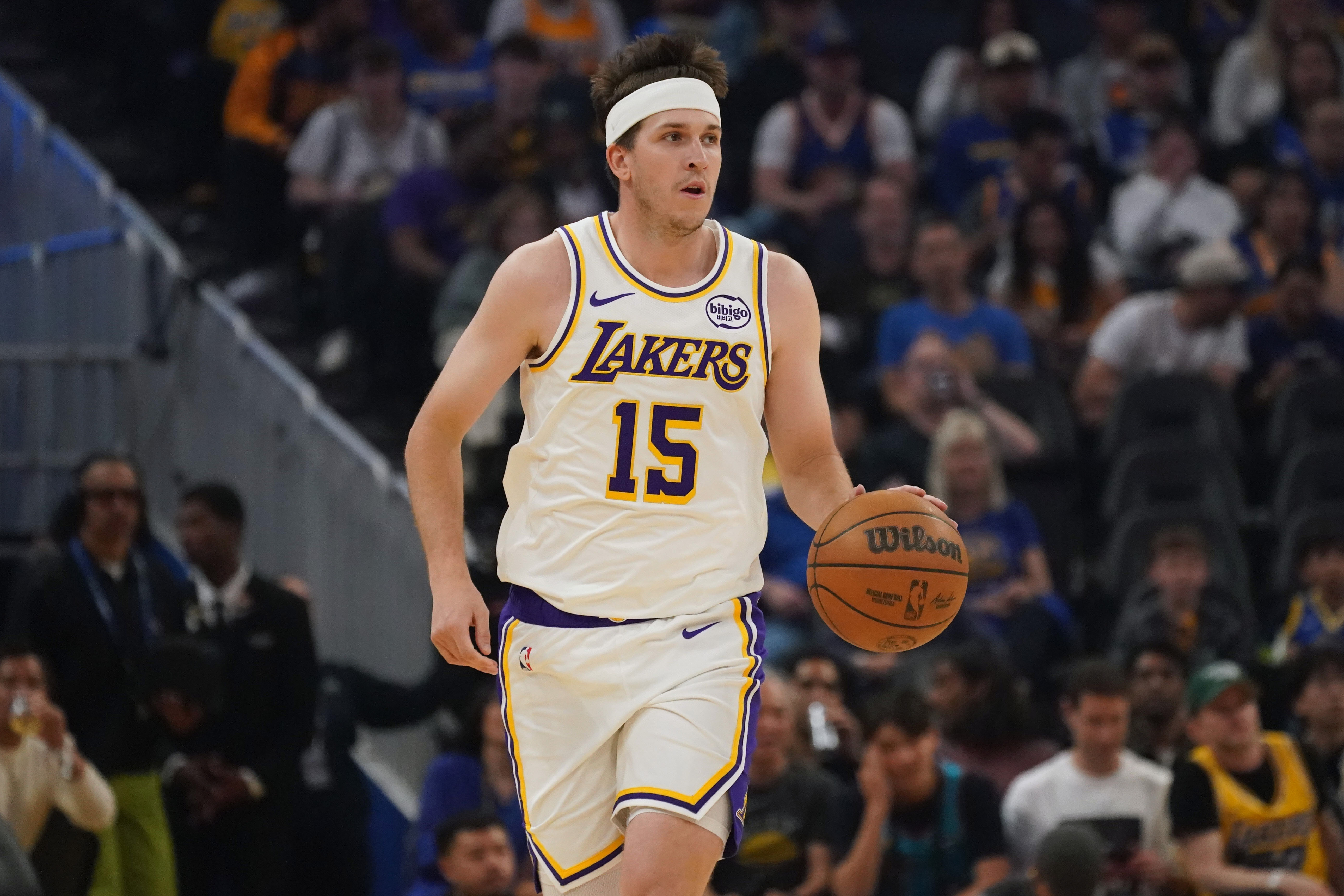 Los Angeles Lakers guard Austin Reaves (15), seen here dribbling during a game, is featured in our NBA player props tonight.
