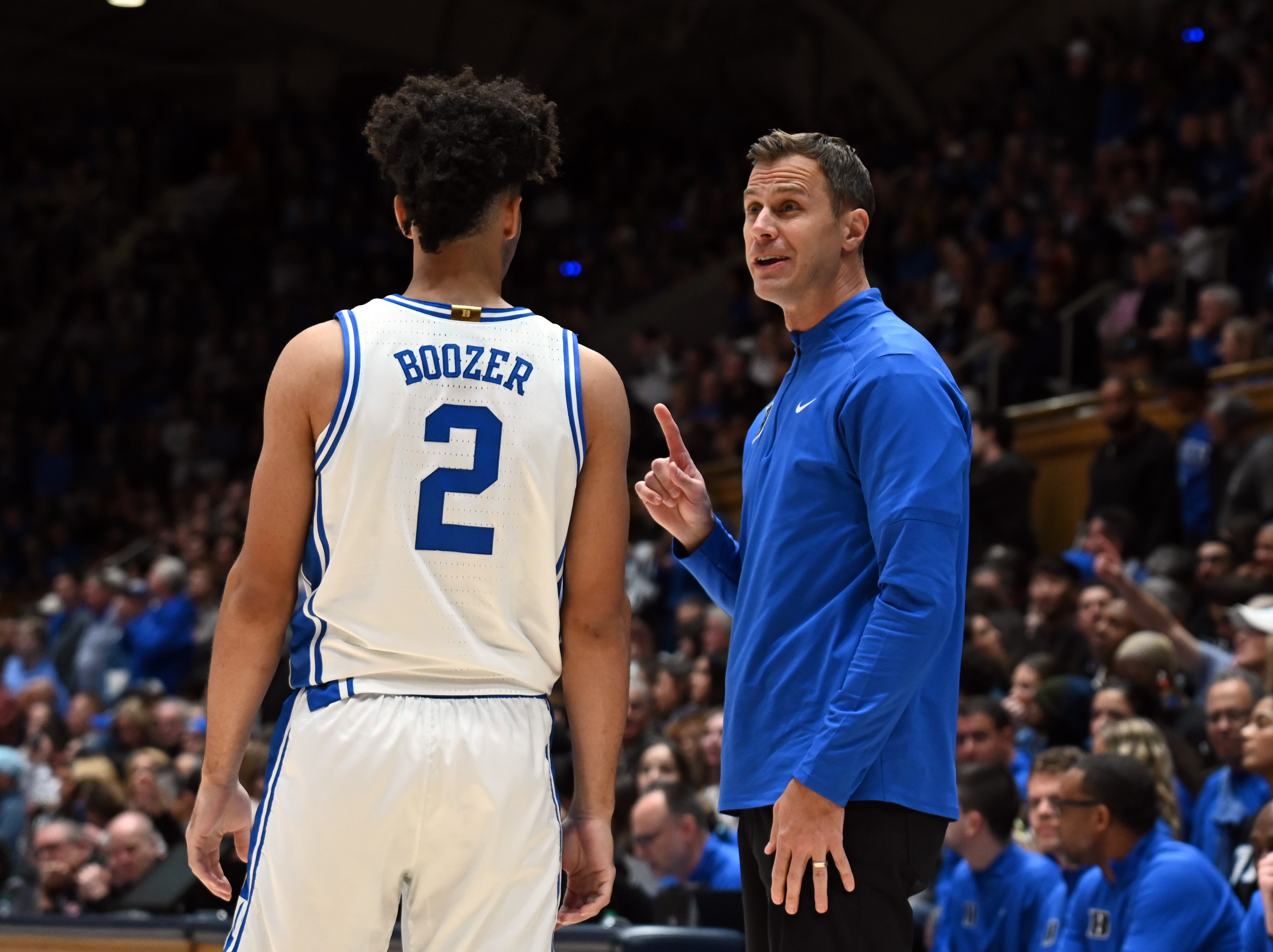 Duke Blue Devils head coach Jon Scheyer talks to guard Cayden Boozer as we make our best Siena vs. Duke prediction & parlay