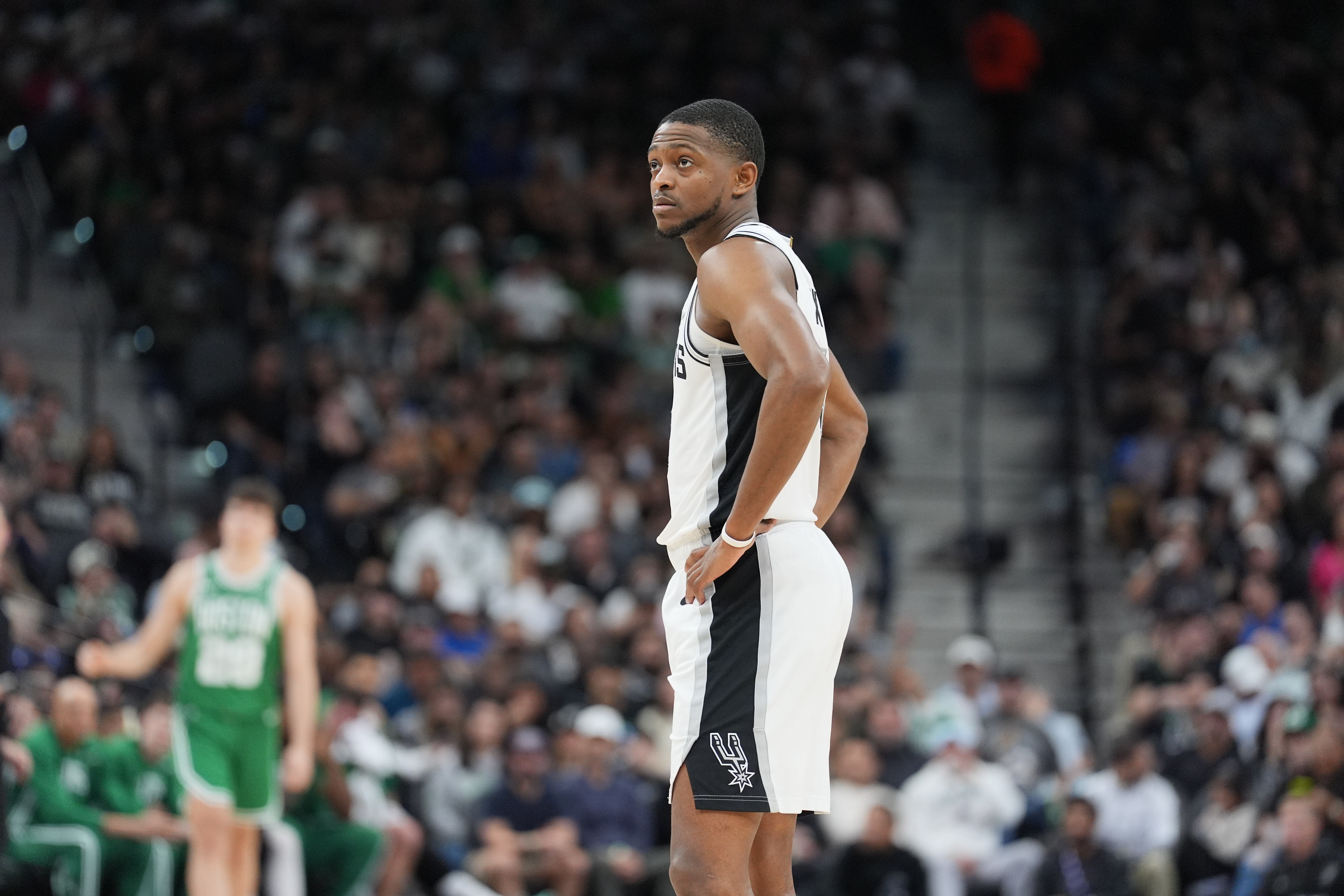 San Antonio Spurs guard De'Aaron Fox (4), seen here looking on during a game, is featured in our NBA player props today.
