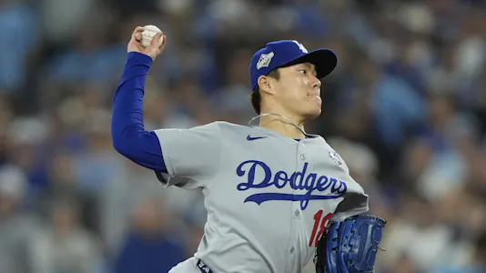 Los Angeles Dodgers pitcher Yoshinobu Yamamoto (18) pitches against the Toronto Blue Jays as we break down our Dodgers vs. Blue Jays player prop bets for World Series Game 6.
