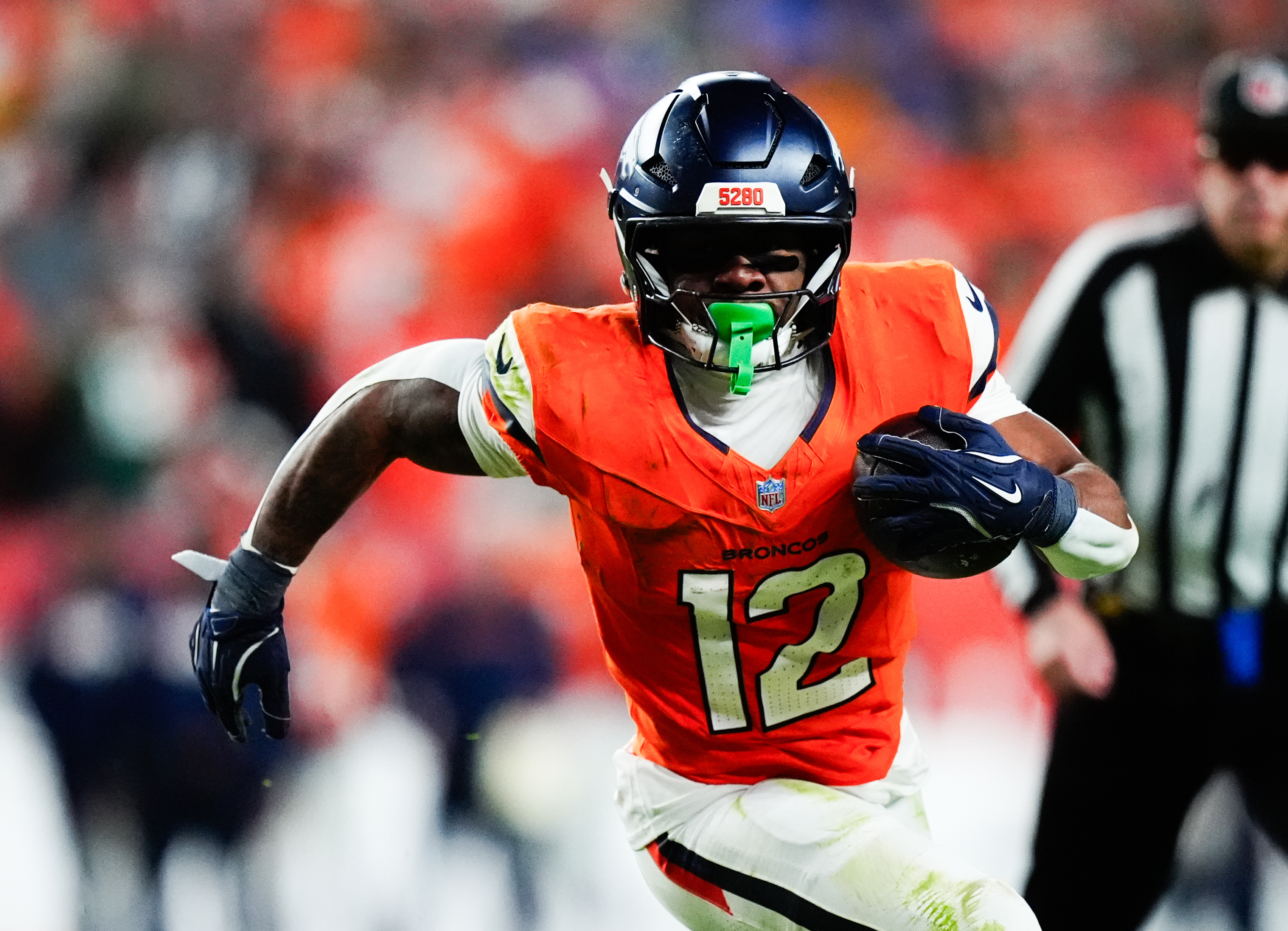 Denver Broncos running back RJ Harvey (12) runs as he is featured in our Broncos vs. Chiefs expert picks for Chirstmas Day.